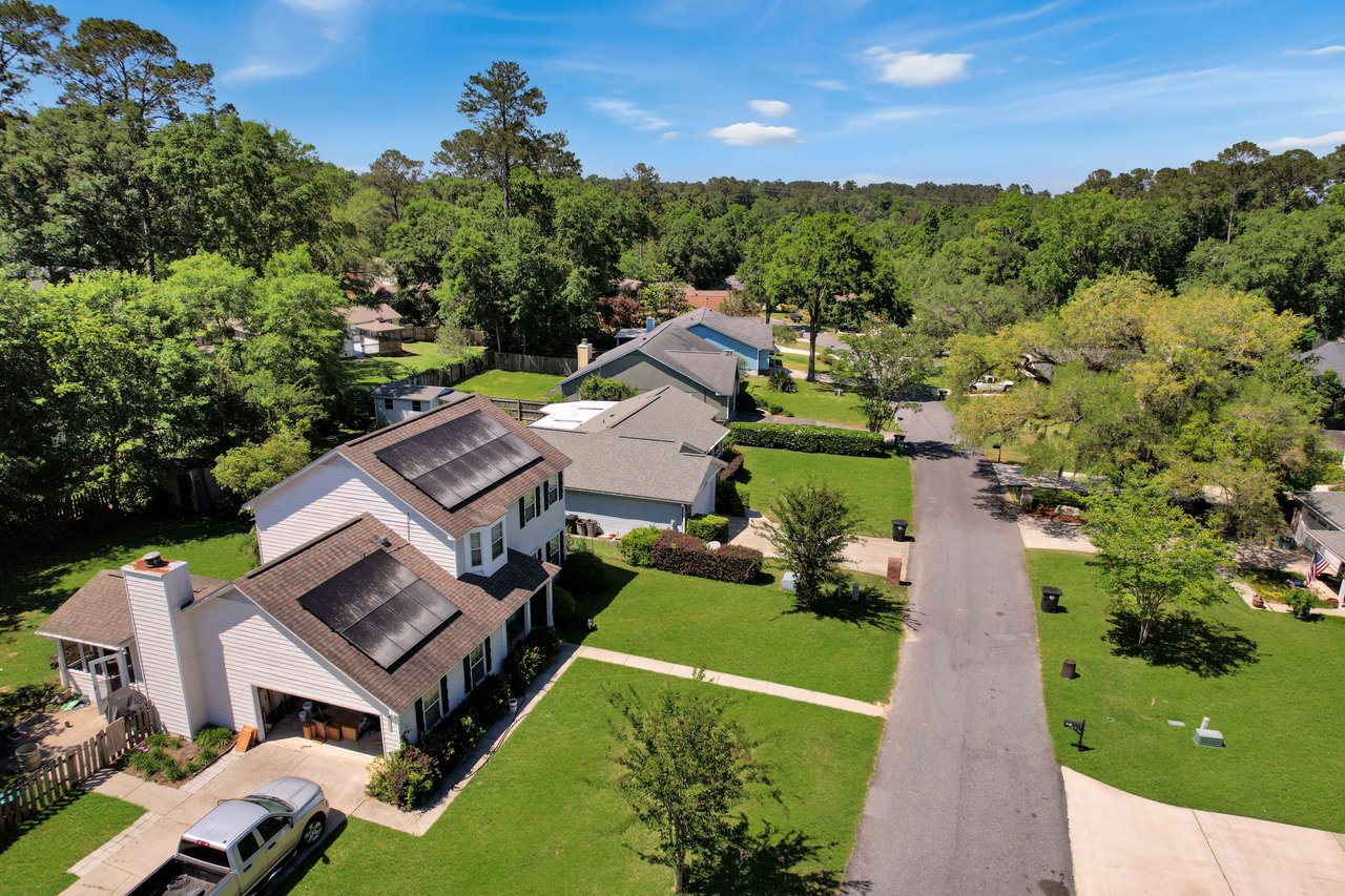 An aerial view of a residential street in Centerville Trace, showing houses and greenery.