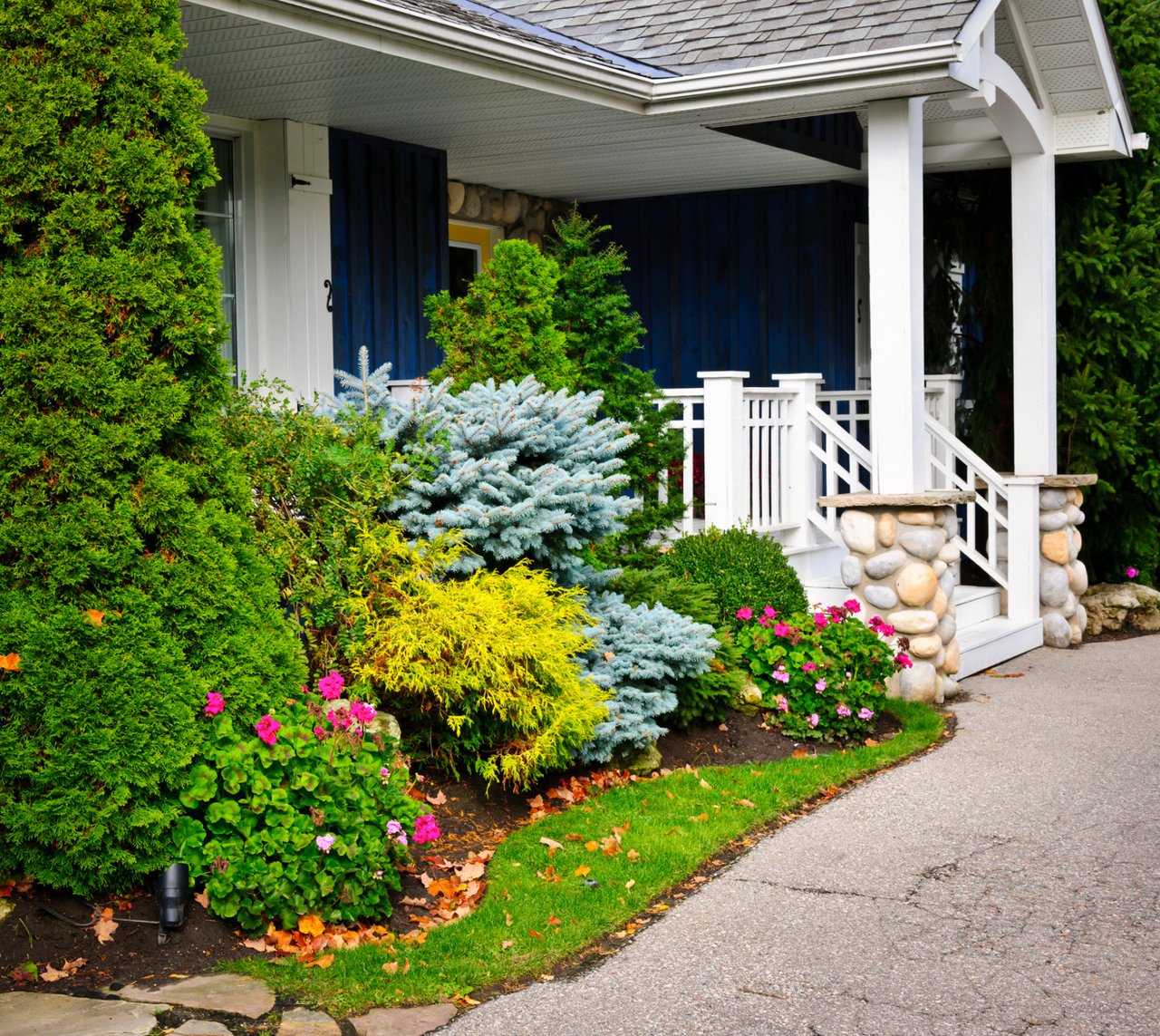 A house with a white porch and stairs.