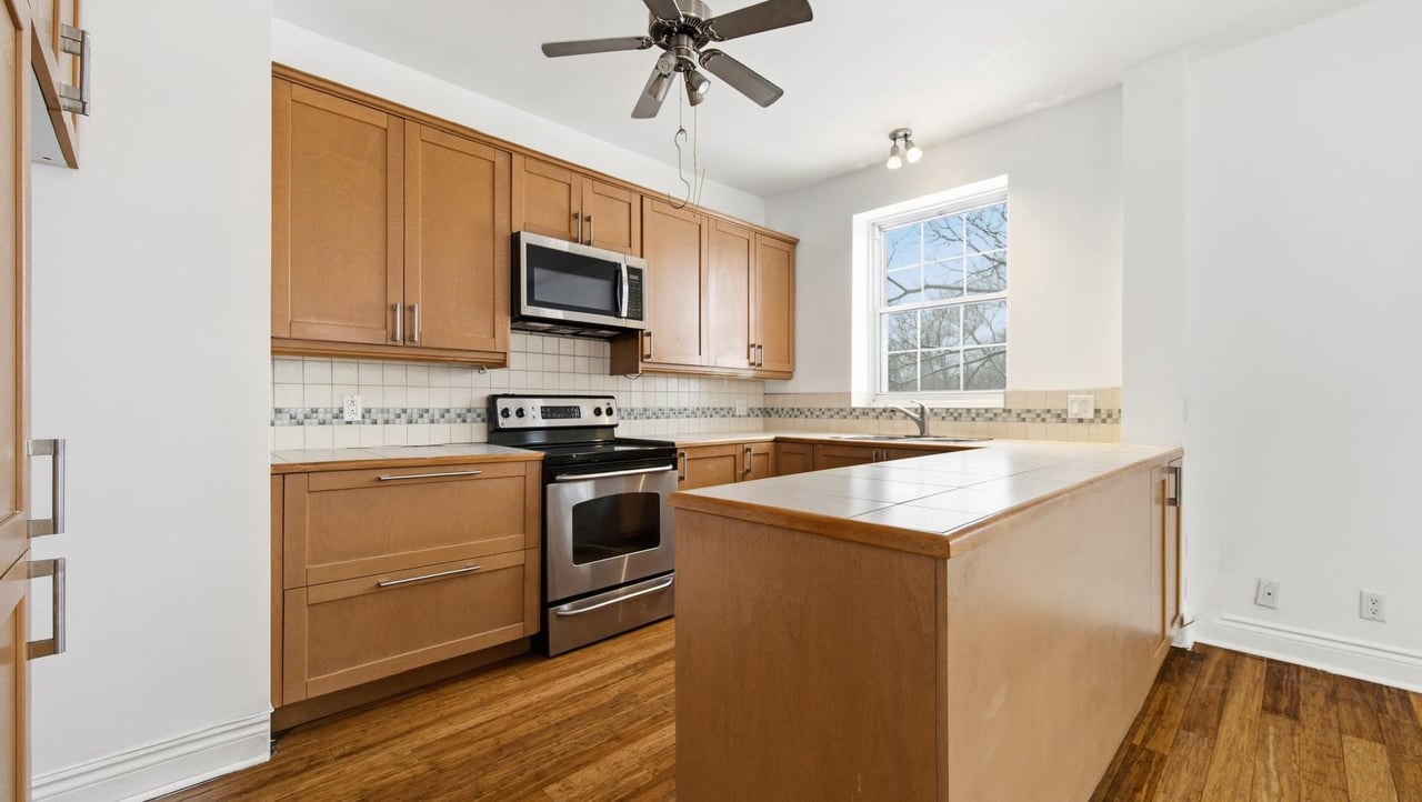 At the edge of Westmount | Corner unit with a view of Mount Royal
