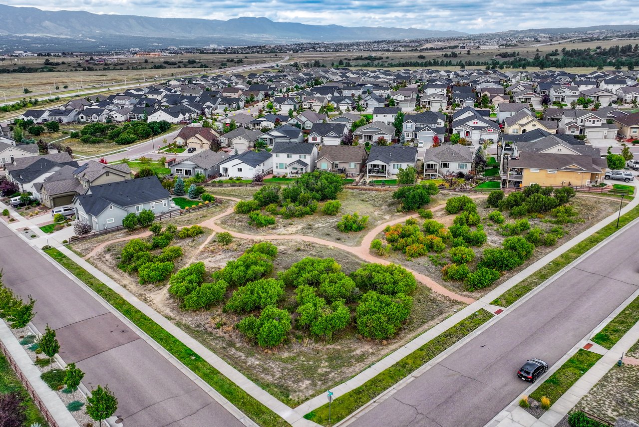 Aerial view of native open space with walking trails