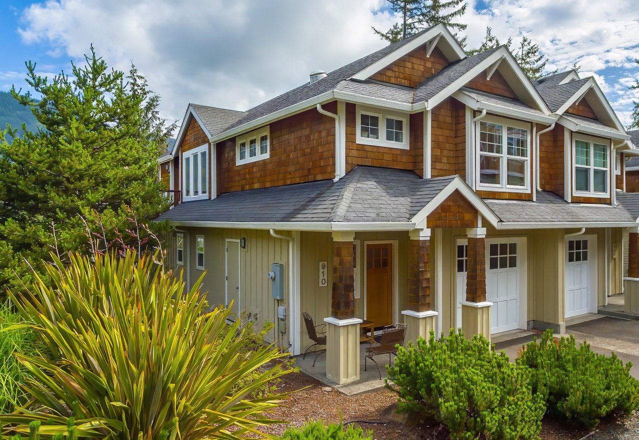 Sold townhouse at 910 Cherry St in Manzanita, Oregon, represented by Meadow Davis of Home + Sea Realty, with a garage and beach access nearby.