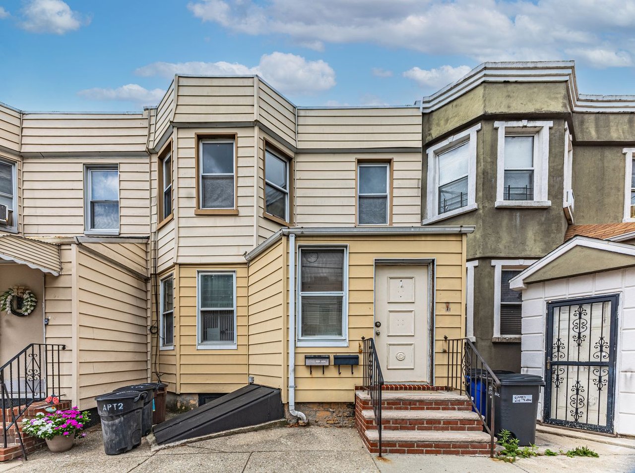 Two family home at 6442 65th Ln in Middle Village Queens sold by The Parviz Team at Compass.