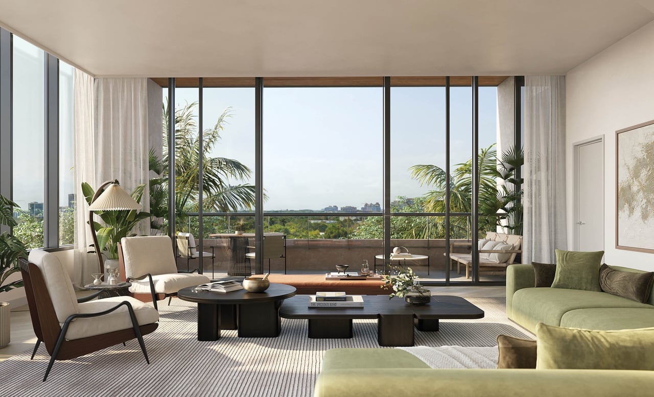 Living room with floor-to-ceiling windows, a terrace, palm trees, and a green sofa.