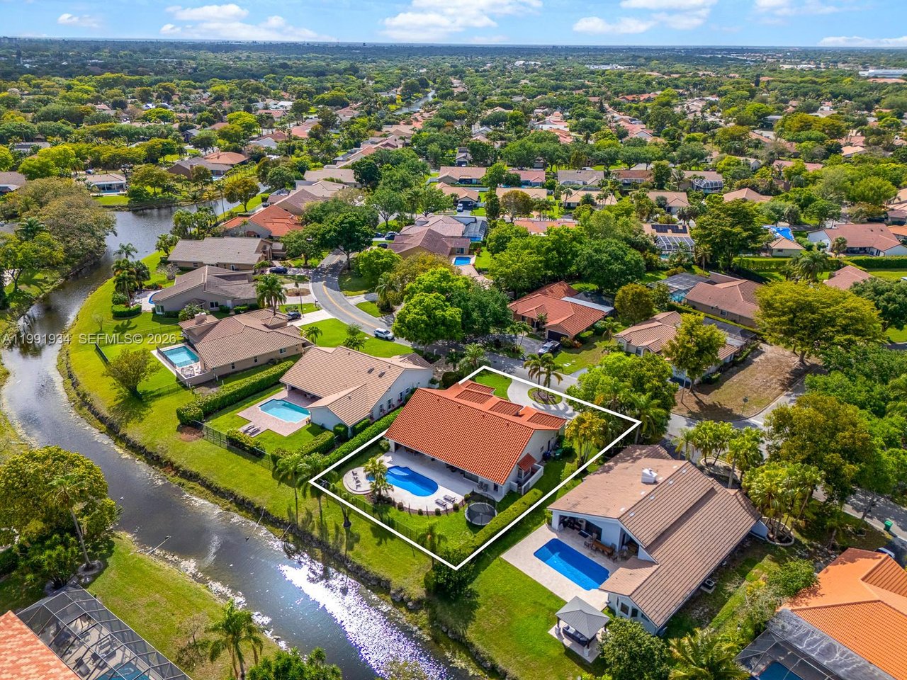 New To The Market: 8412 NW 52 Place, Coral Springs ​| Luxury Waterfront Pool Home in Pine Ridge For Sale