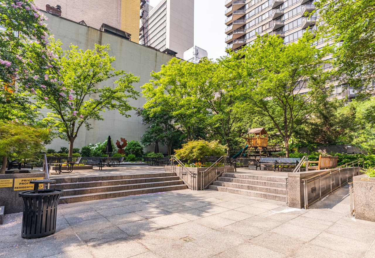 Luxury Manhattan condominium outdoor amenities featuring landscaped gardens, rooftop deck, private terrace, courtyard, dog run, outdoor lounge, and children's playground.