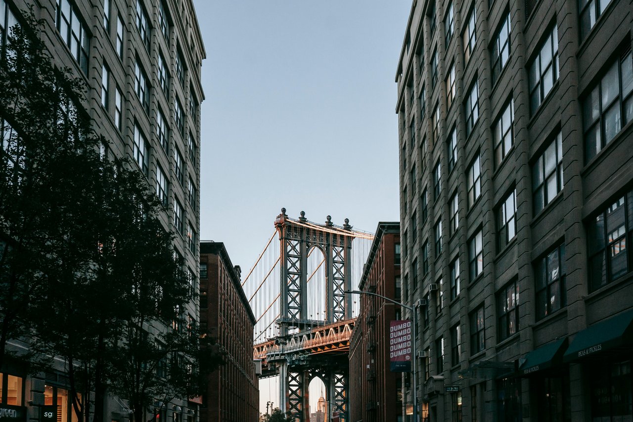 Waterfront DUMBO brooklyn overlooking Manhattan skyline showing the bridge.