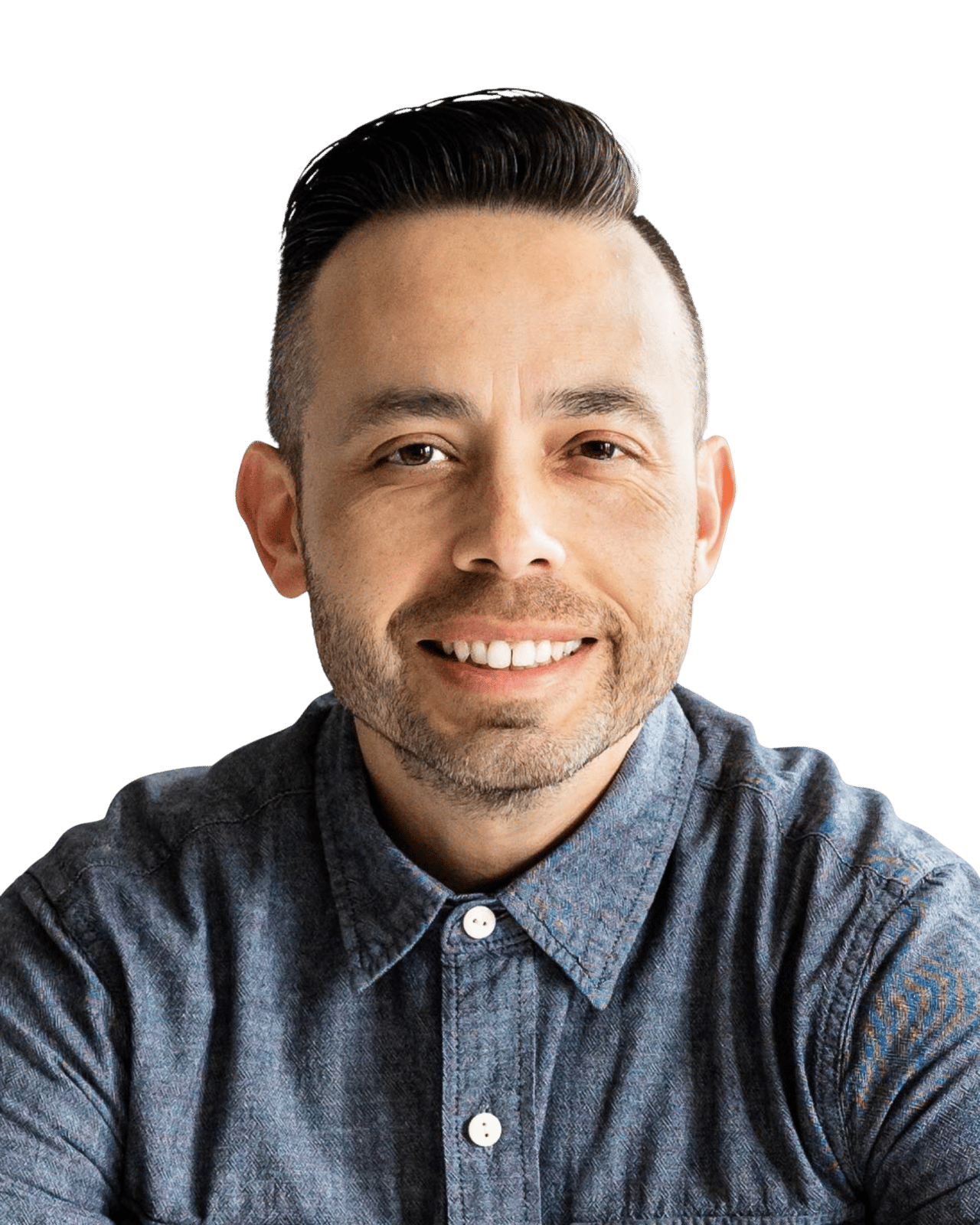 Ruben Espejel smiling in a blue patterned button-up shirt.