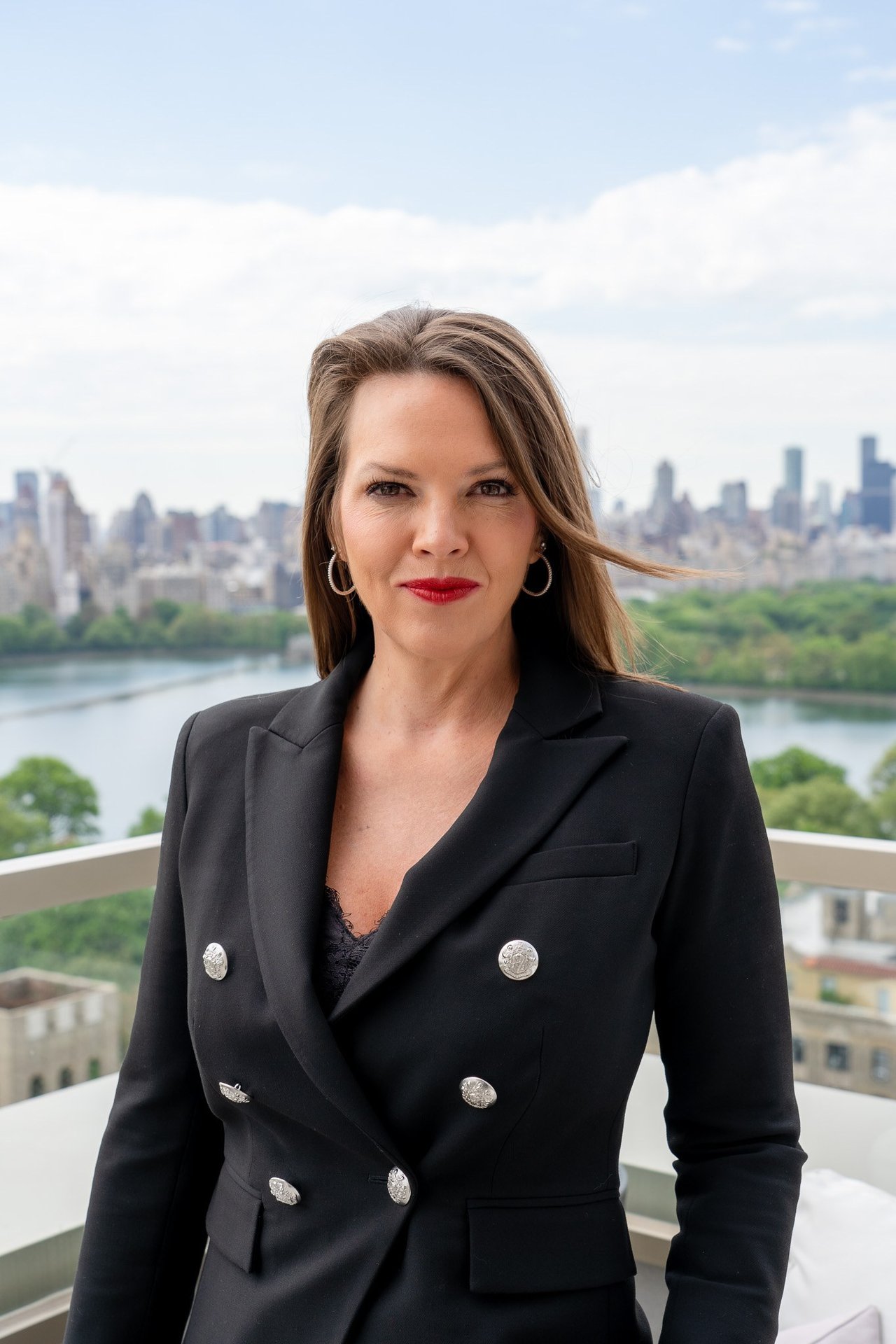 Kelly Burchill, Tampa and Manhattan real estate advisor, overlooking the New York City skyline