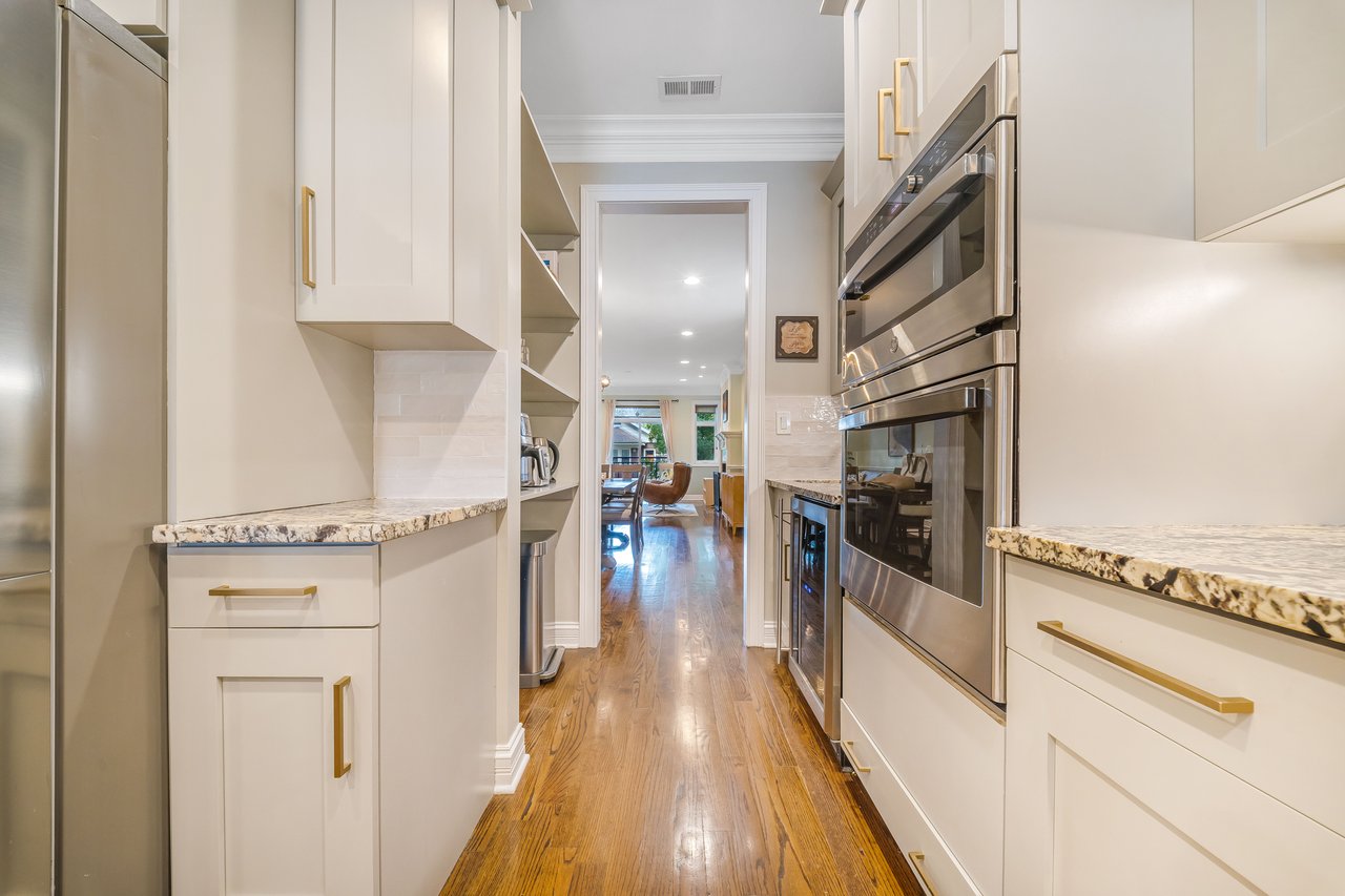 Kitchen with double wall oven and extra cabinet storage