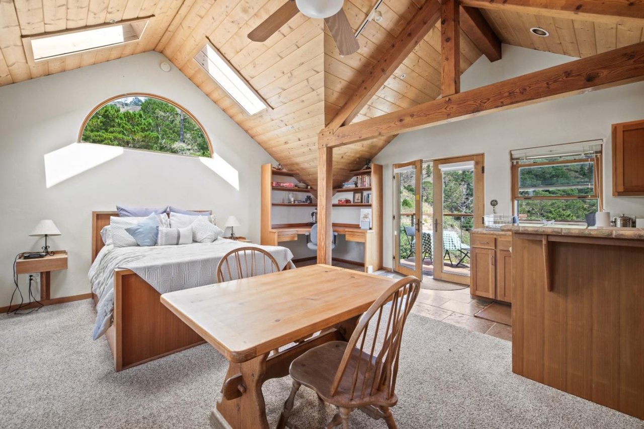 ADU bedroom with wood finishes and ample natural light in $5.5M Carmel Highlands property