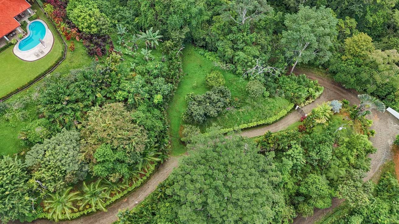 Ocean, jungle & mountain views on a meticulously landscaped 3-home family compound