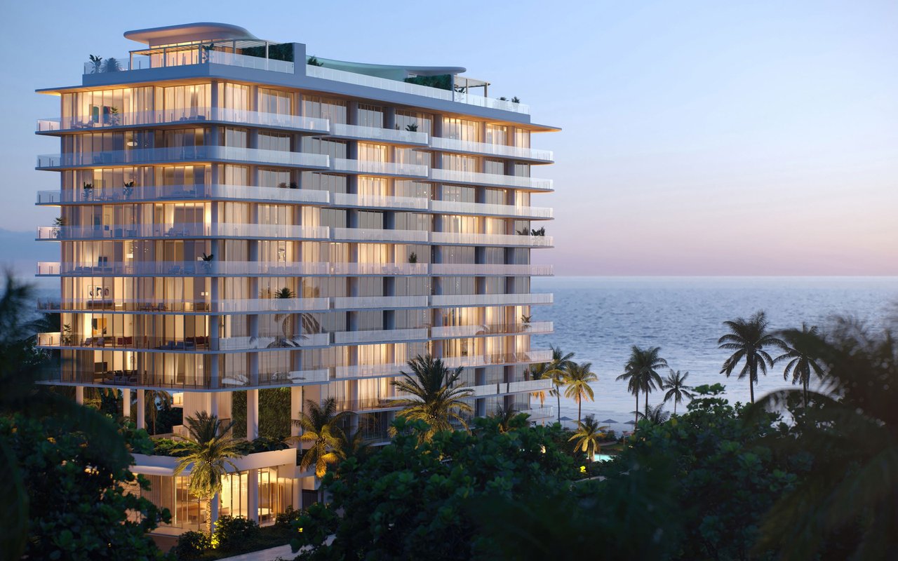 Ocean House Surfside exterior rendering at dusk with illuminated residences.