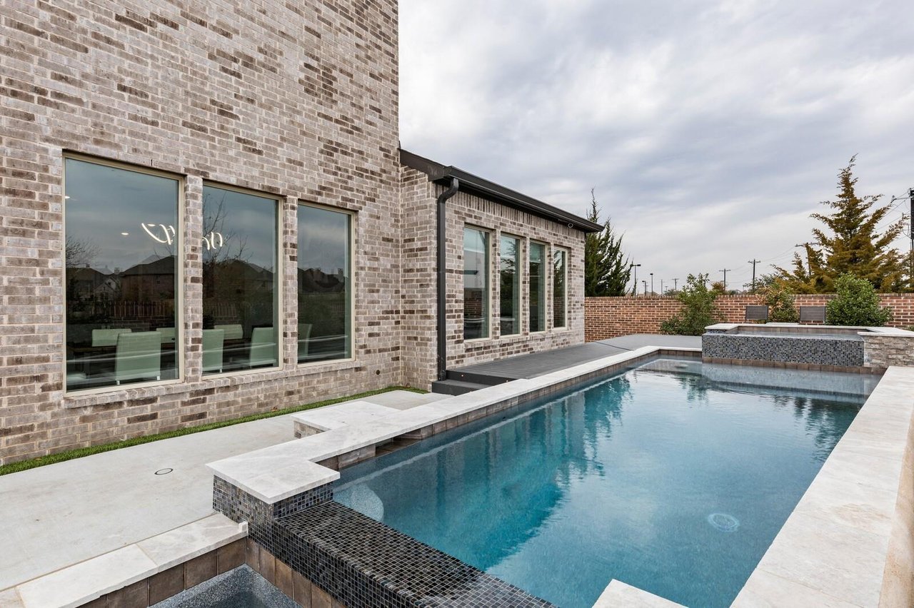Private resort-style pool and outdoor living space in a luxury home in Phillips Creek Ranch, Frisco TX — North DFW's most sought-after master-planned community.