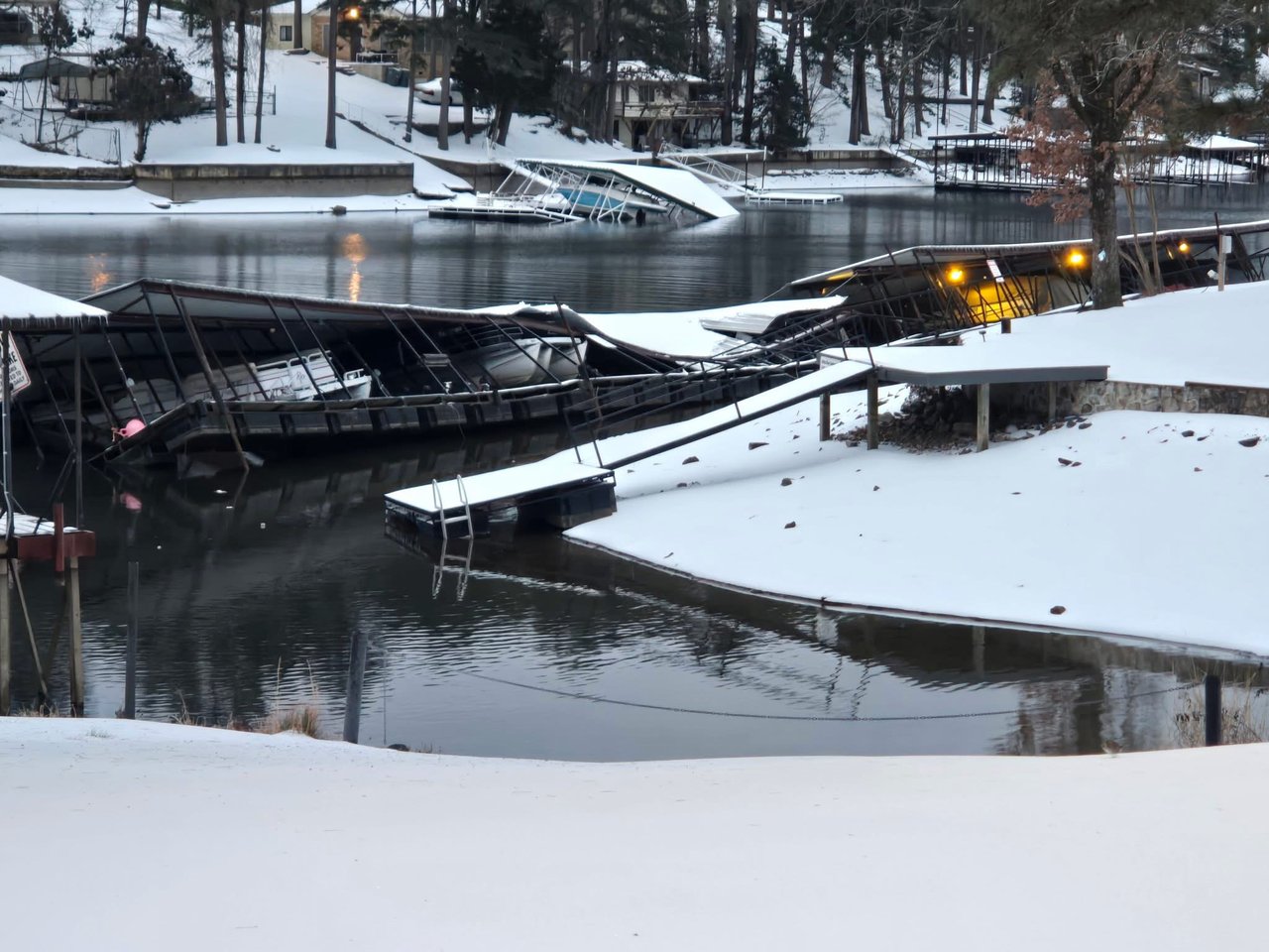 The recent winter storm brought more than just snow to Lake Hamilton – it brought significant damage to many boat docks, especially older floating structures.