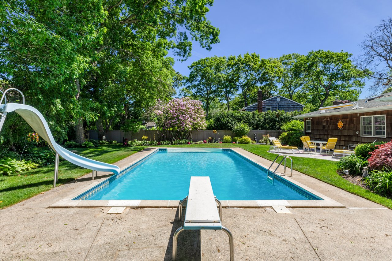 A Quiet Village Setting with a Pool at Its Center