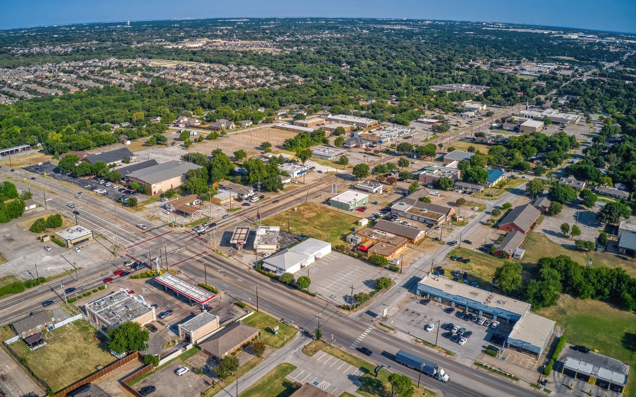Aerial view of DeSoto’s commercial district, major roads, nearby homes, and tree-lined neighborhoods.