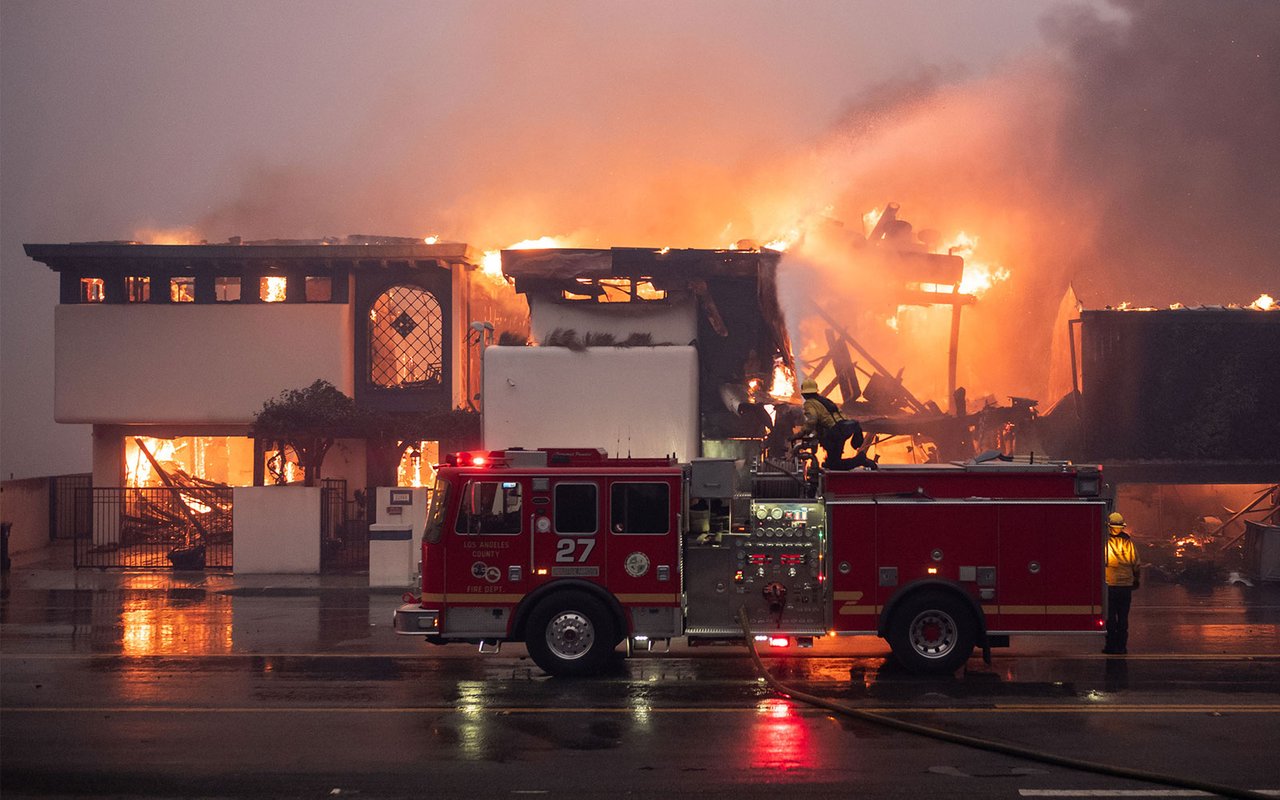 Fires Burn Through LA Neighborhoods As Agents Mobilize