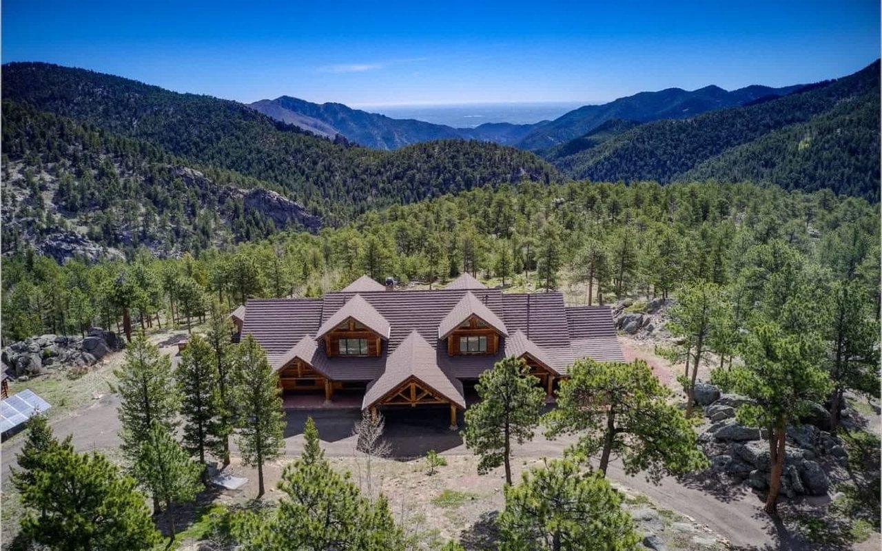 Palatial Log Retreat Bordered by Roosevelt National Forest