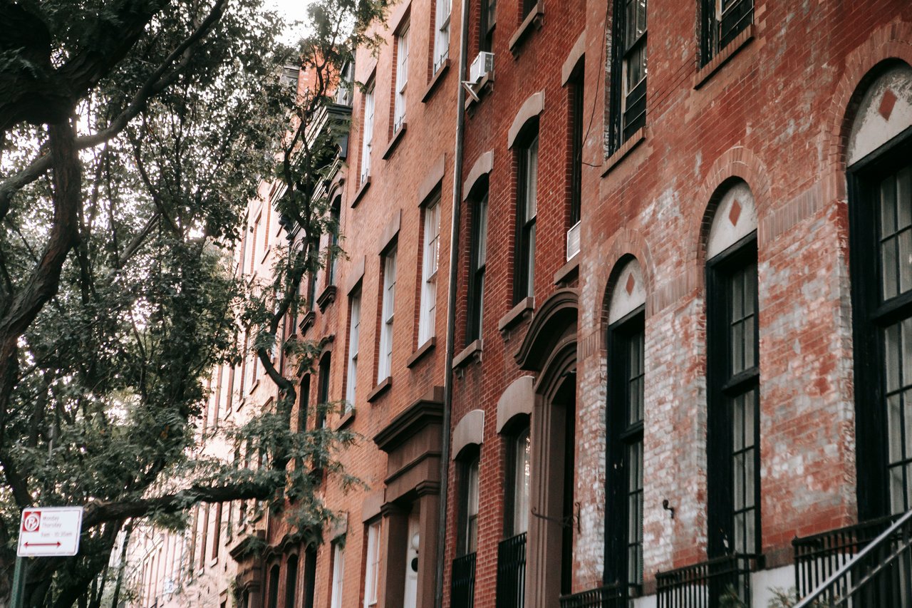 Historic townhouses, multifamily homes, loft buildings, and boutique condominiums along Troutman Street in Bushwick, Brooklyn.
