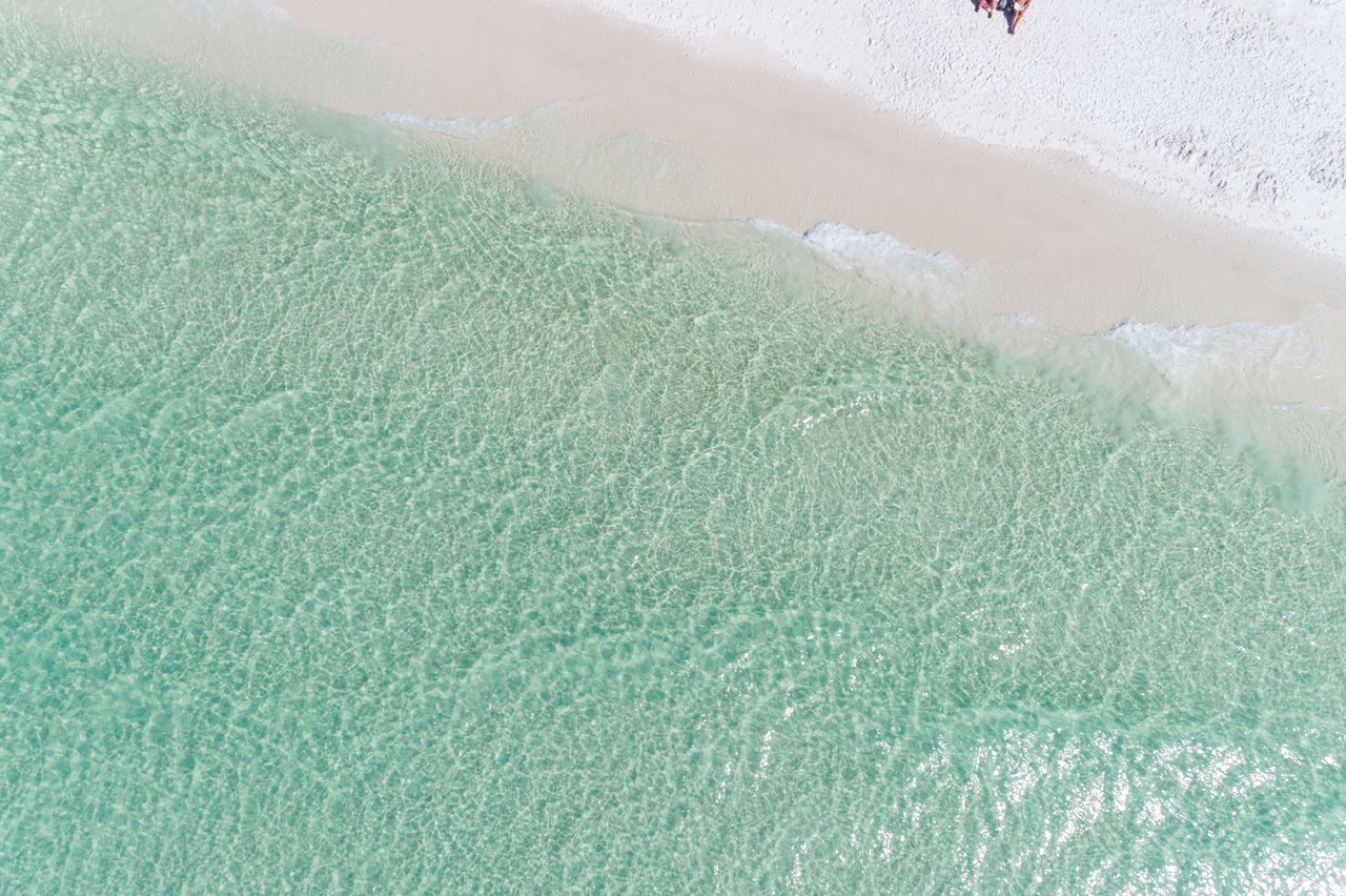 Clear emerald waters and white sand of Seagrove Beach Florida, where 30A real estate serves up it’s best beach homes and investment properties.