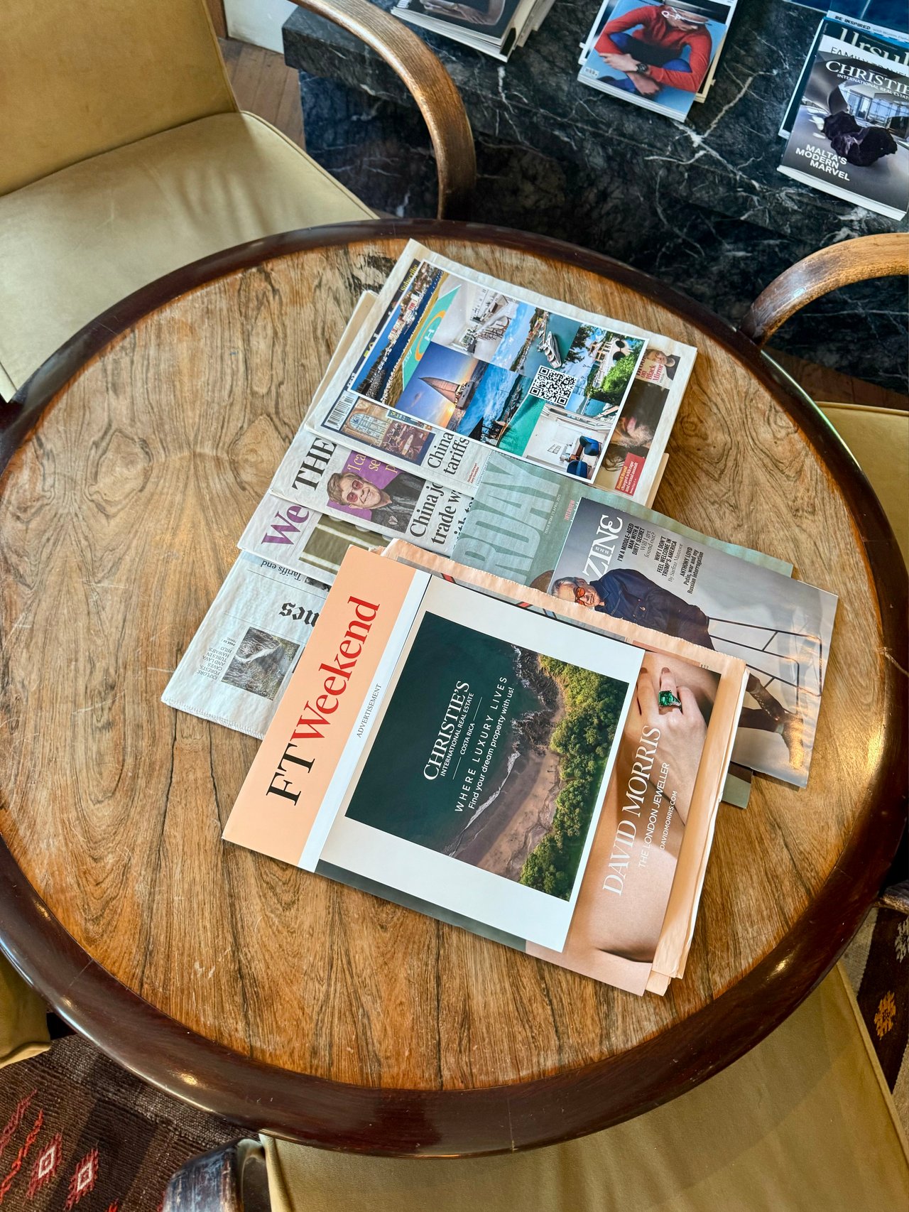 Overview of Costa Rica Christie's Branded Material displayed on a coffee table at the London stop of the EMBRACE Tour