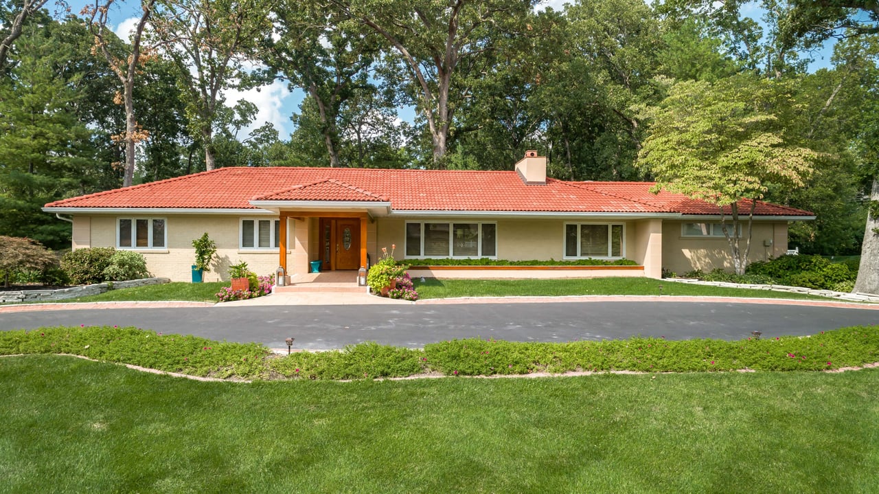 A Special Retreat on a Prized One Acre Lot With Pool and Tennis Court