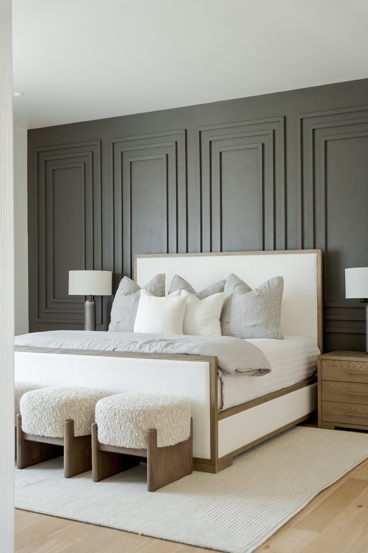 Elegant primary suite in a luxury Oklahoma City home, styled for winter with layered textures and warm neutral tones.