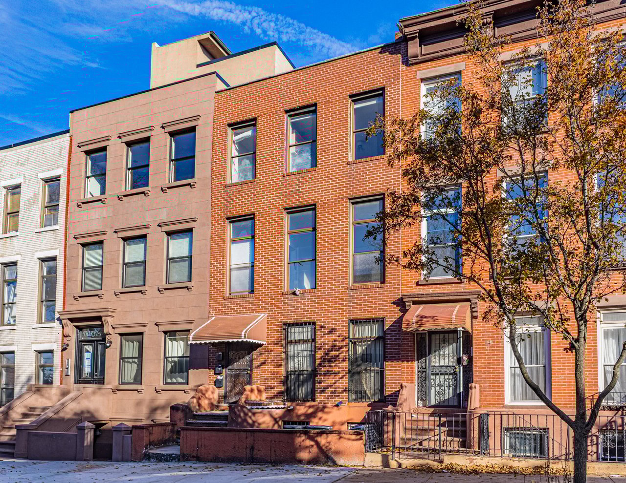 Brick multifamily townhouse at 37 Woodhull St in Columbia Street Waterfront District Brooklyn sold by The Parviz Team at Compass.