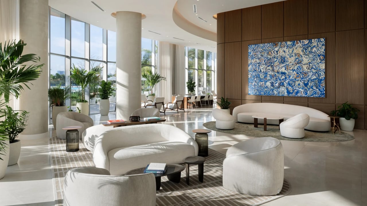ONE Park Tower residential lobby with lounge seating and tall windows.