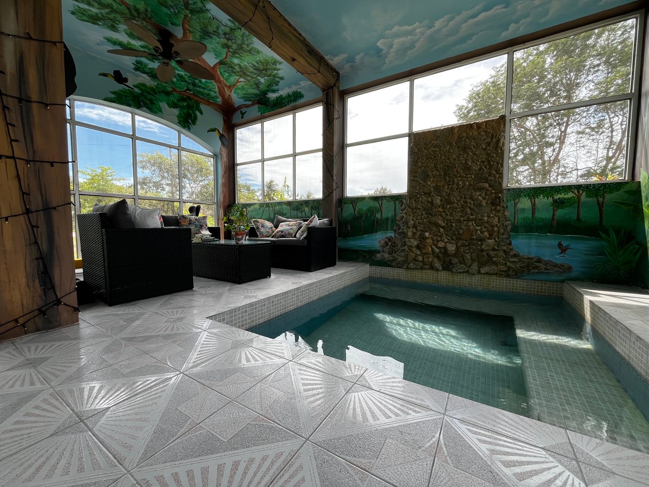 Tiled floor, plunged pool, and waterfall
