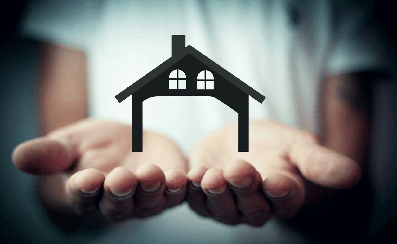 A black house symbol floats above open hands.