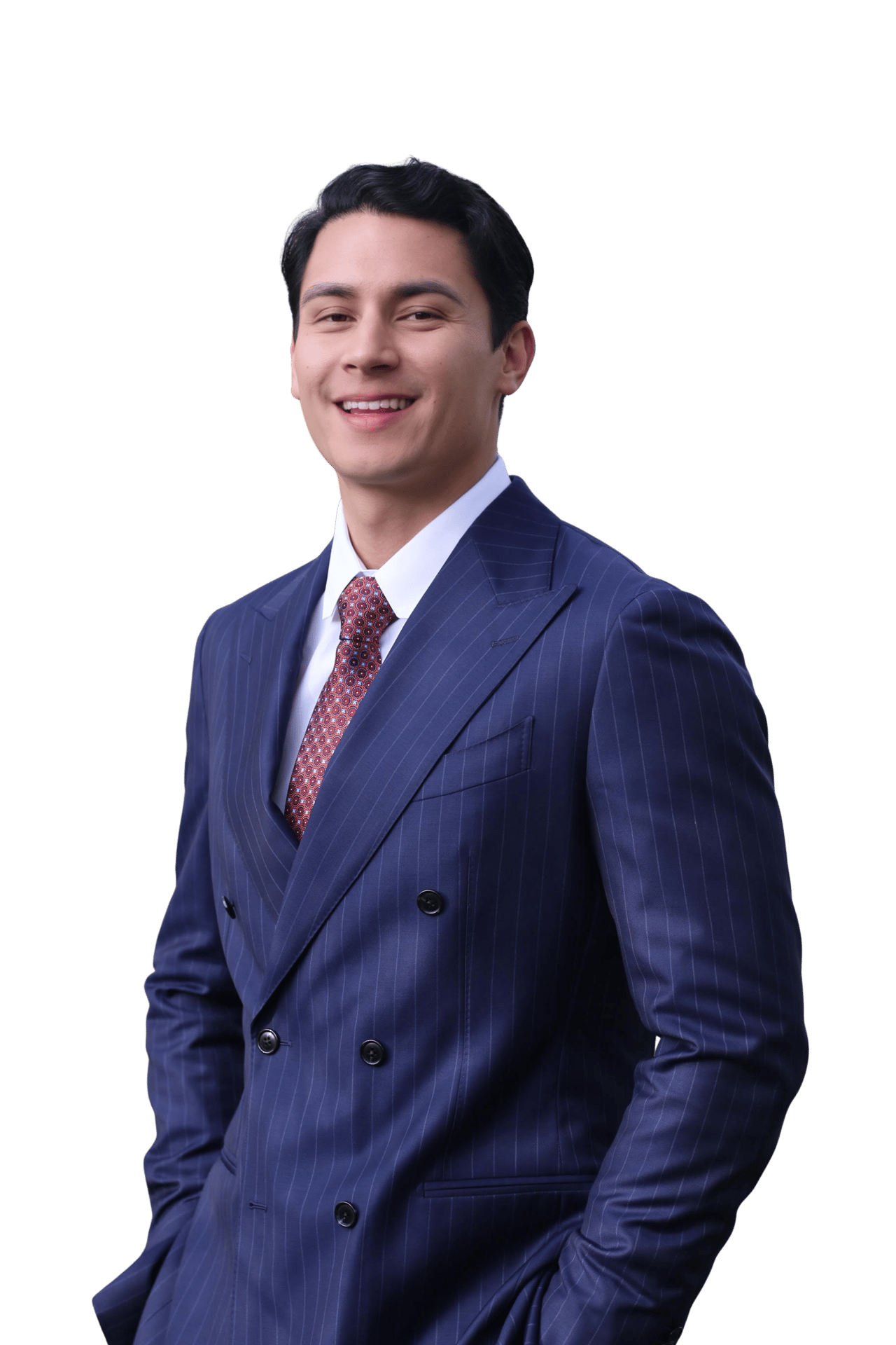 Daniel Kienast wearing a navy pinstripe suit and patterned tie.