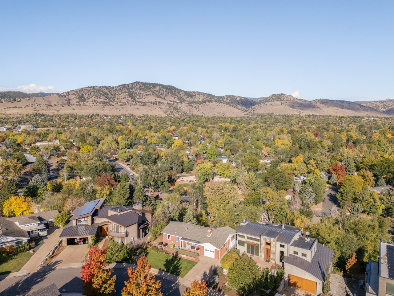 Aerial view of 2003 Balsam Drive and surrounding Hillcrest homes in Boulder with the foothills to the north