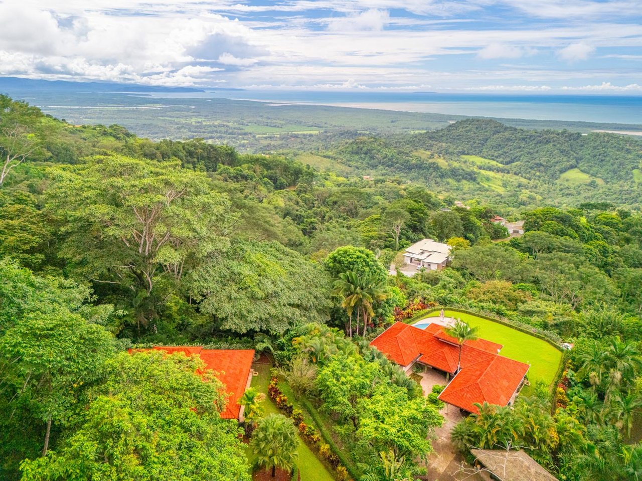 Ocean, jungle & mountain views on a meticulously landscaped 3-home family compound