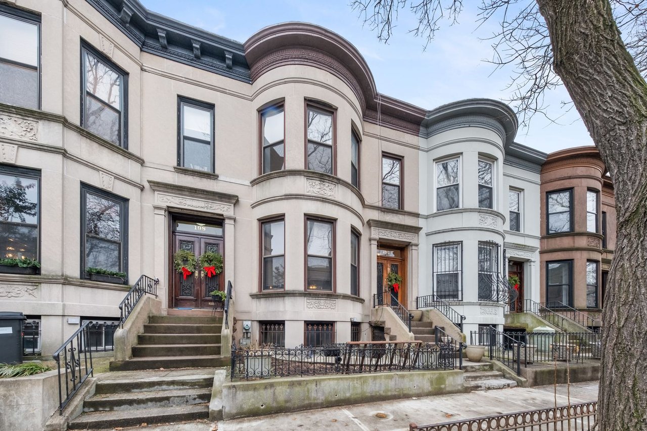 Historic limestone townhouse sold at 196 Maple St in Prospect Lefferts Gardens Brooklyn by The Parviz Team at Compass for one million eight hundred seventy thousand.