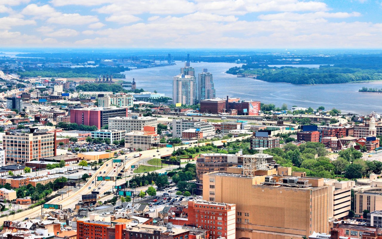 Aerial view of Northern Liberties, with city buildings, the Delaware River, and the Camden waterfront.