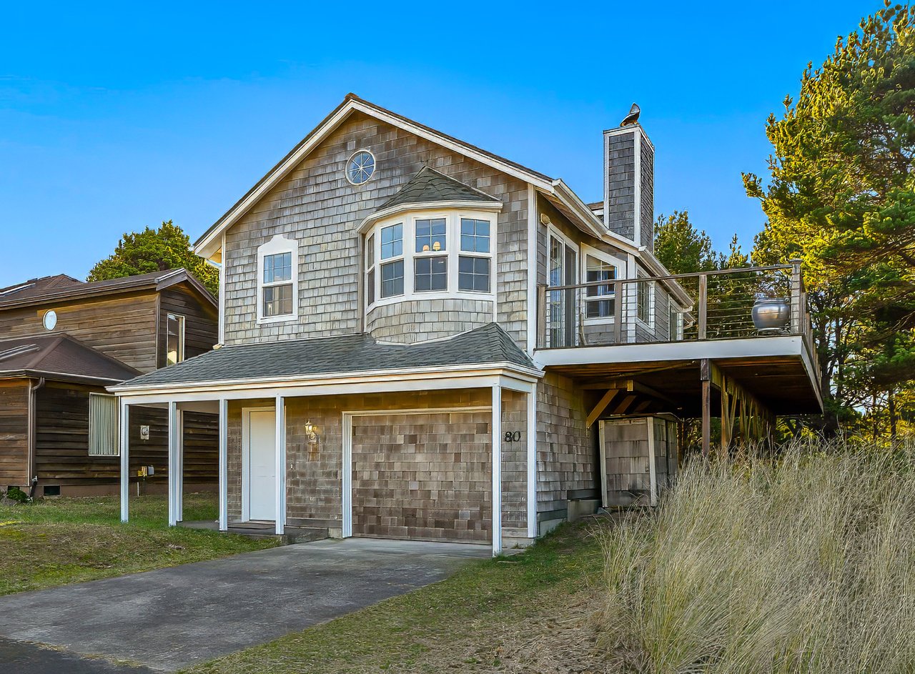 Exterior view of the sold beach-close cottage at 80 Beach Dr in Manzanita, Oregon
