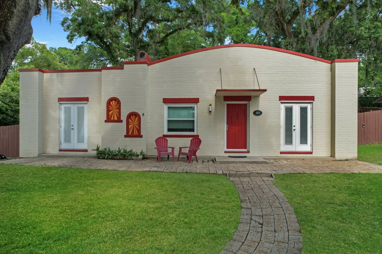 front photo of a classic pueblo style home at 1647 Lake Ella Drive in Tallahassee Florida Home for Rent