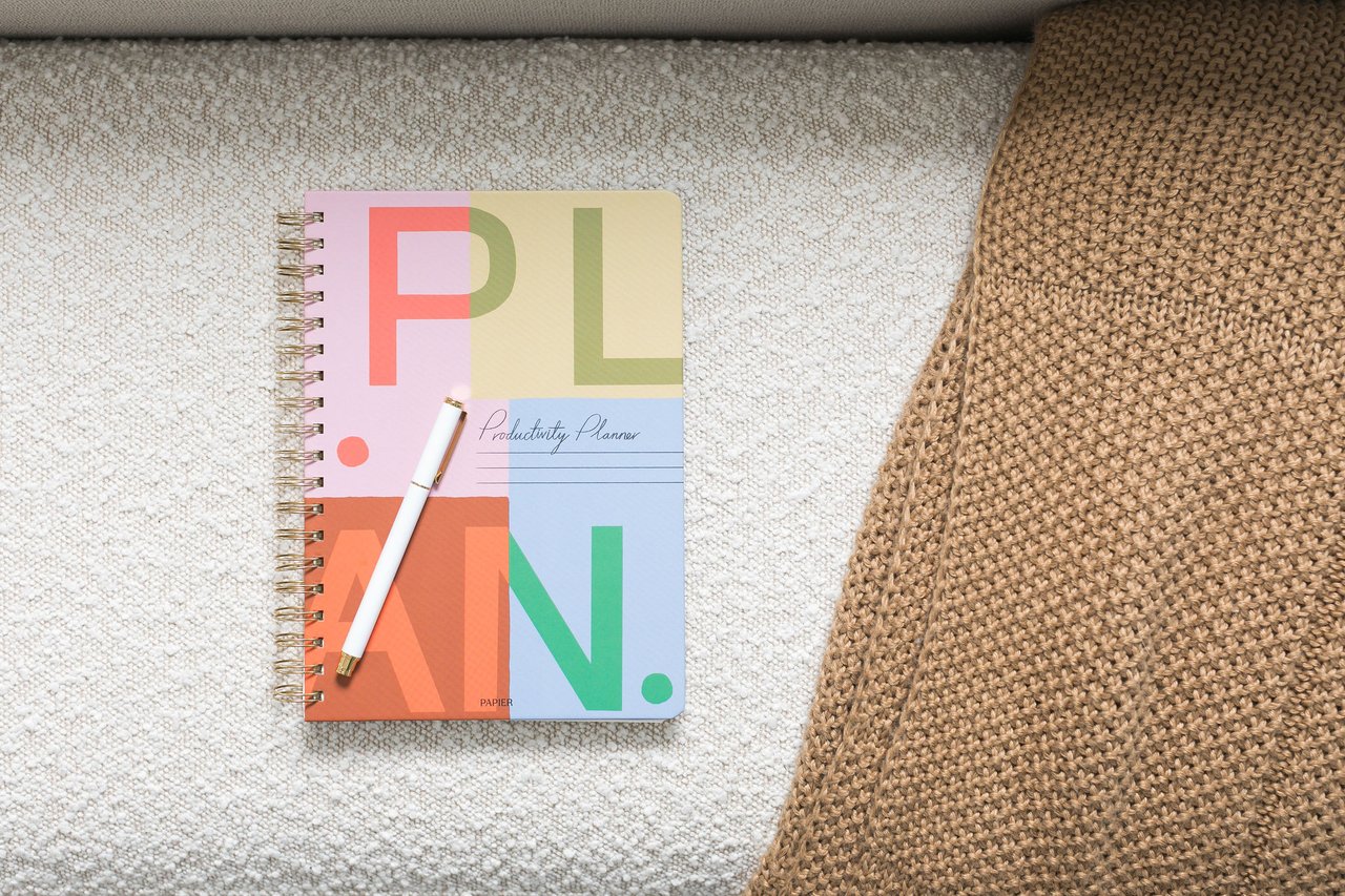 A planner and pen on a chair, suggesting a family thoughtfully working through the decision of choosing senior living.