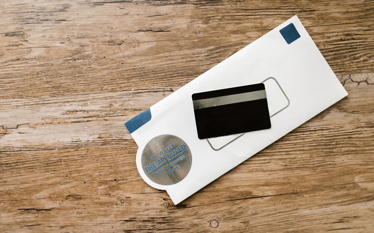 Credit card on an envelope marked “You've been pre-approved for the offer inside.”