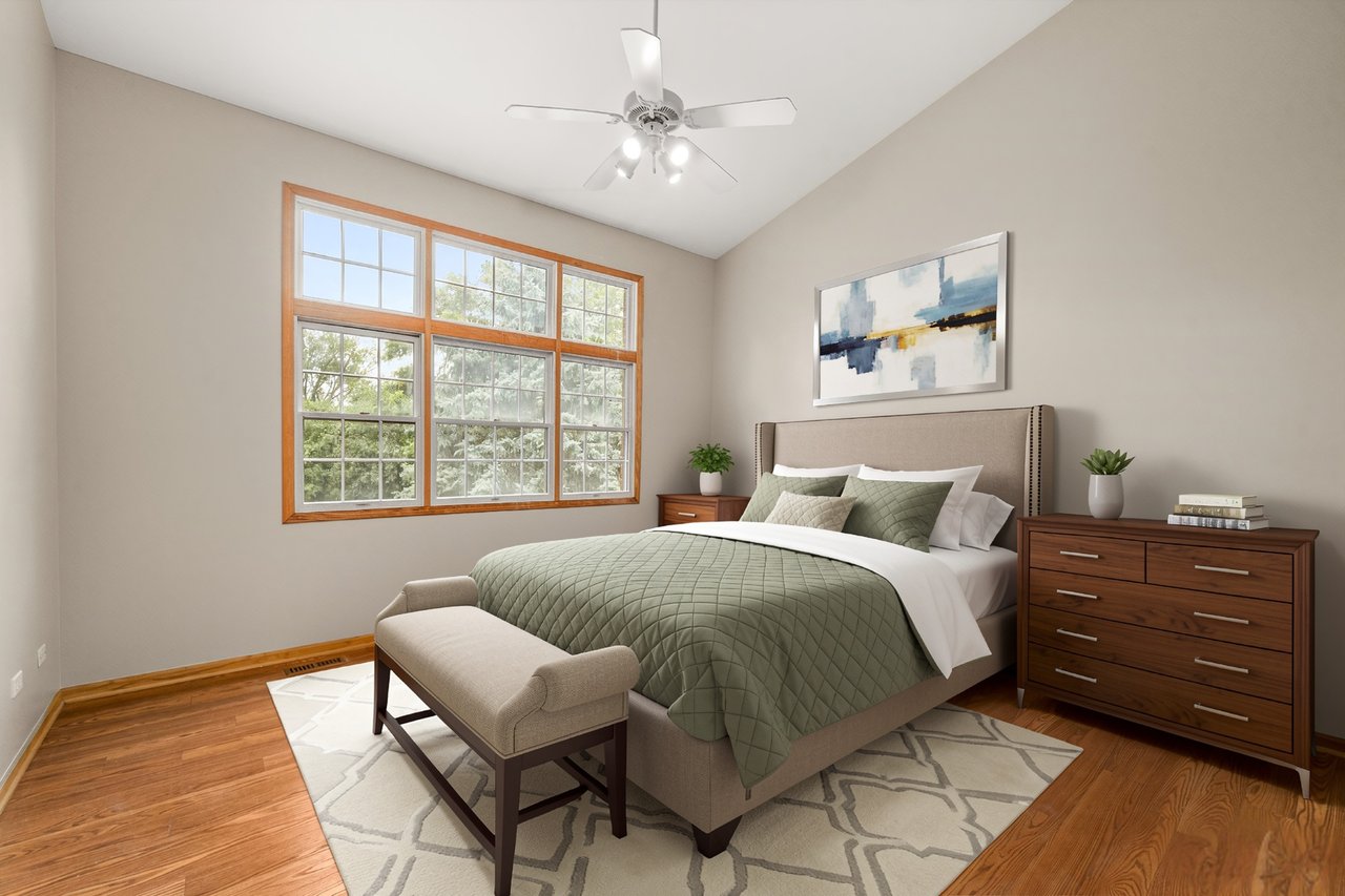 Main level primary bedroom suite at 2137 Prairie Lane Woodridge IL with private full bath