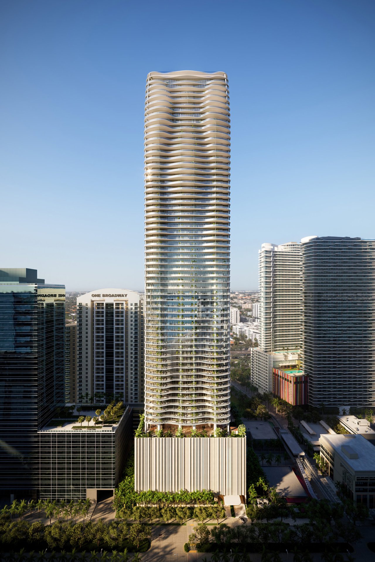 The Residences at 1428 Brickell tower with curved balconies, rising above the surrounding Miami skyline.