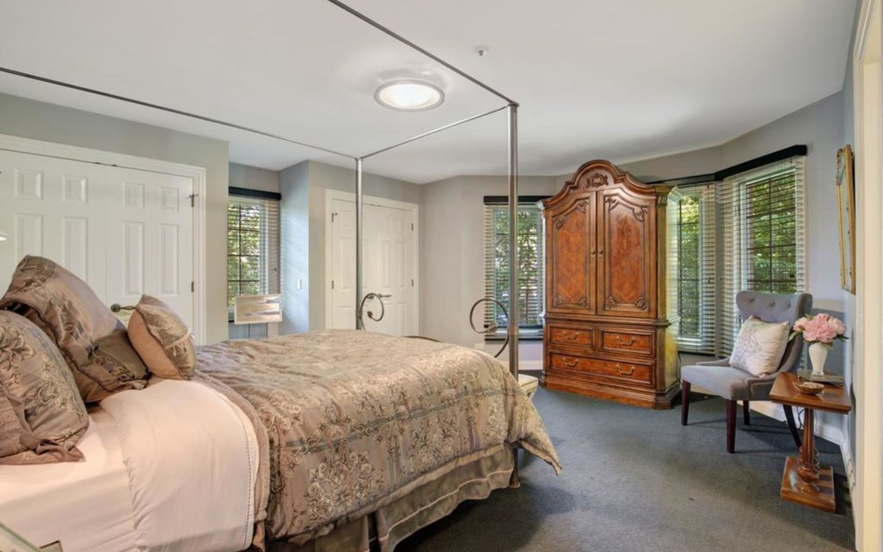 This Stately Brick Traditional Home Is Uniquely Positioned On One Of The Most Private Lots In Royal Melbourne