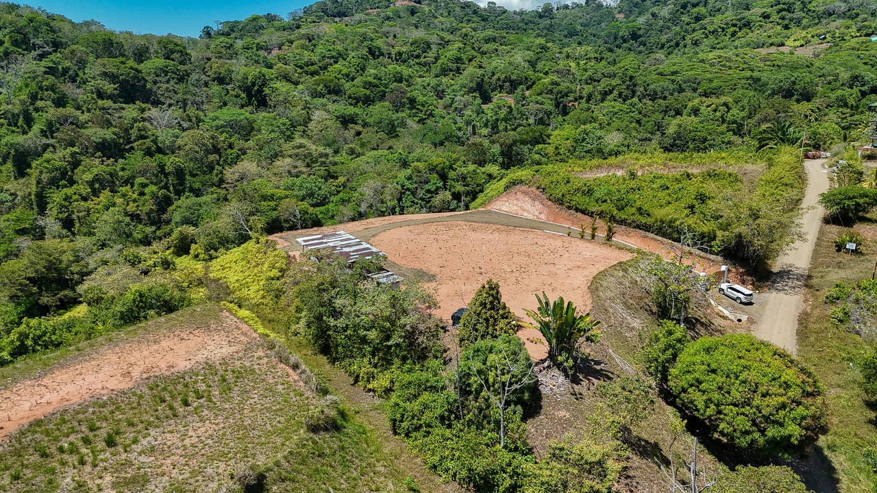 An elevated, prepared river lot with 360-degree ocean, mountain, valley and jungle views