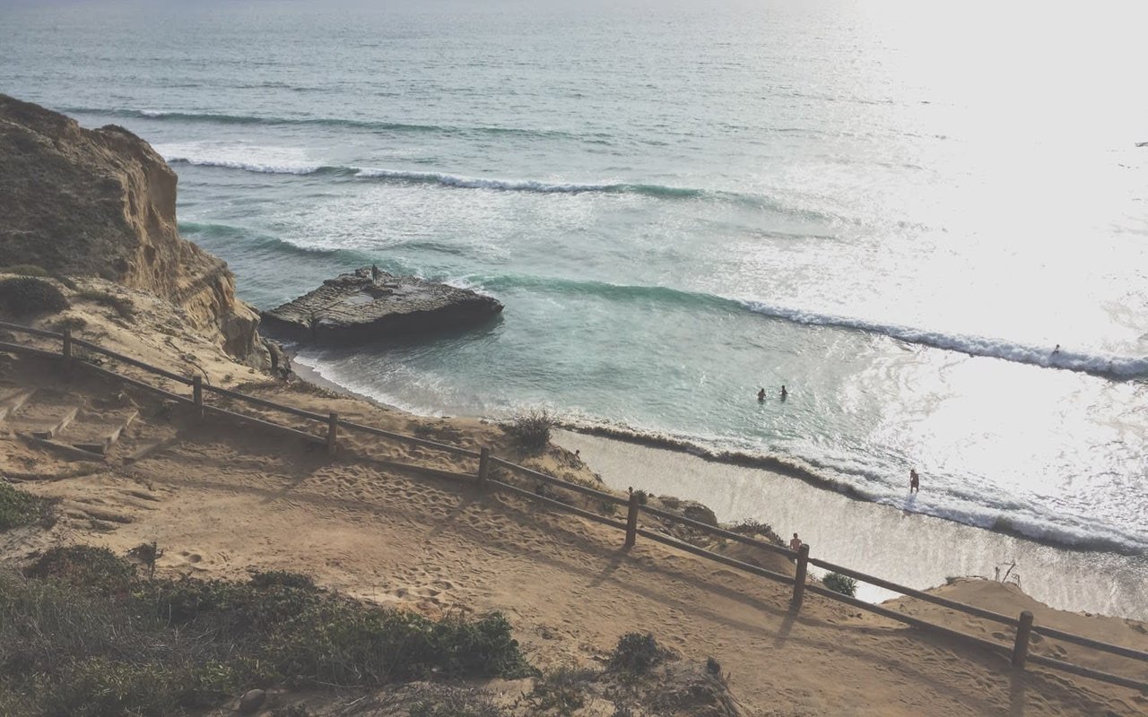 aerial view of a bath on a cliff overlooking the california coast