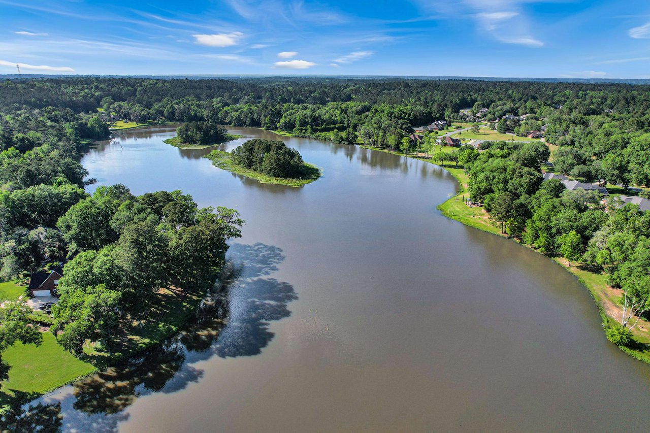 Another aerial view of the lake in Summerbrooke, highlighting the water and surrounding green spaces.