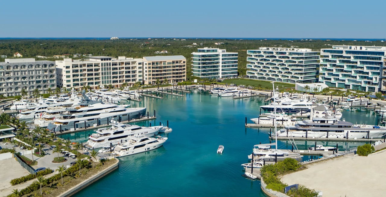 An aerial view of a marina with many yachts and boats docked.