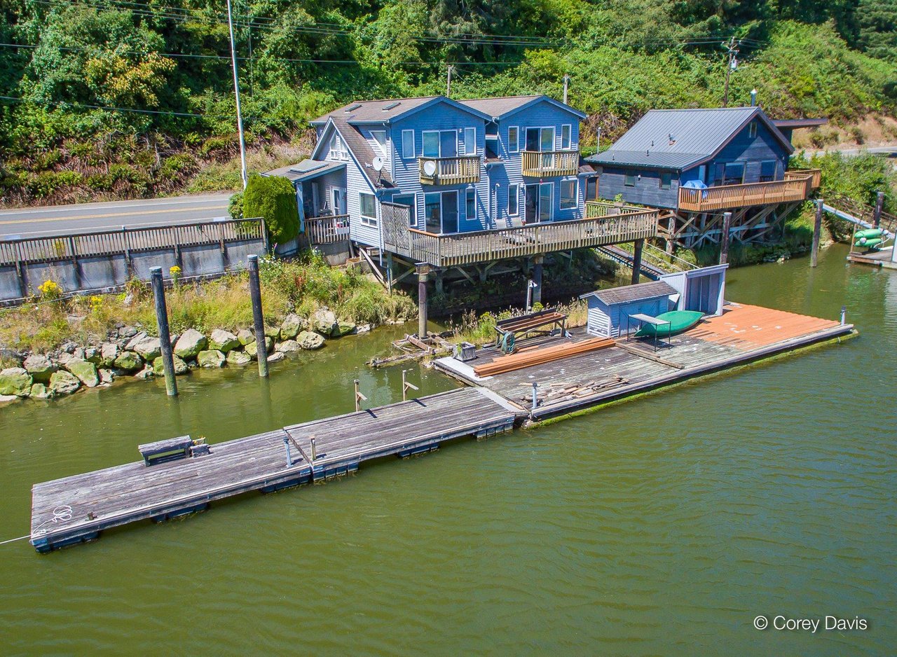 Sold riverfront home at 35275 N Hwy 101 in Nehalem Oregon represented by Meadow Davis of Home + Sea Realty with private dock and water access