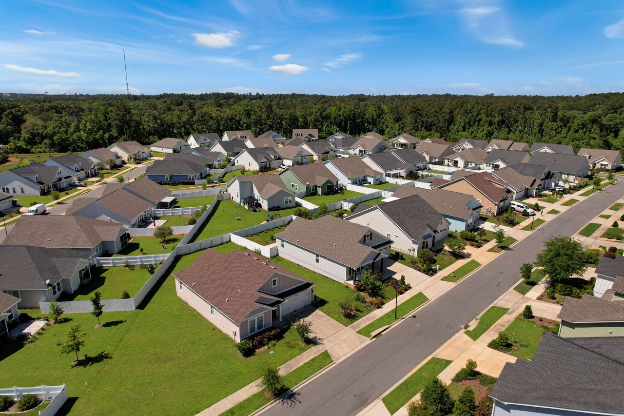 An aerial view of the Canopy community, showing rows of houses and well-planned streets.