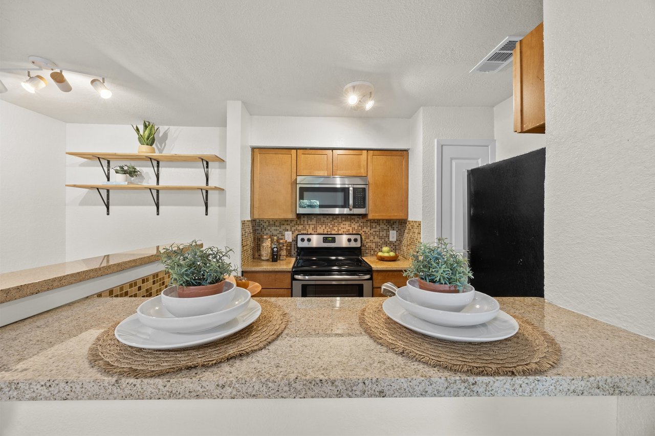 Top-Floor Condo Retreat in Gated Ivy Condos | Private Balcony + Tree-Filled Views